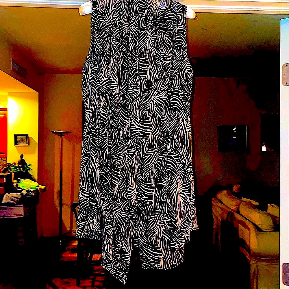 Light airy sleeveless tunic-length topper